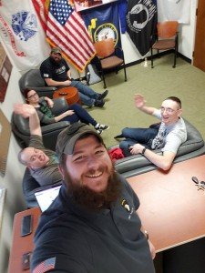A photo of several students sitting in the veteran and military students lounge.