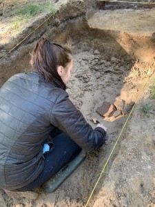 Raegan Delmonico digs at an archaeological site.