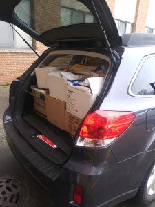 Boxes packed in the trunk of a vehicle.