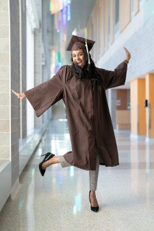Hailey Timmerman poses for a photo in her graduation attire.