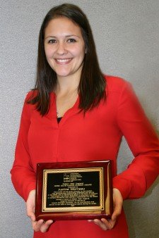 Justine Morneau holds the plaque she received for winning MIRSA's outstanding student award.