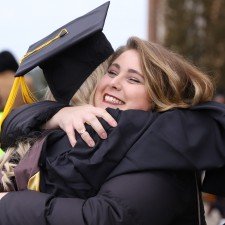 A female graduate gets a hug.