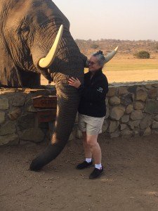 Photo of Noreen Heikes with an elephant