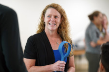 Stacie Fruth holds a piece of physical therapy equipment.