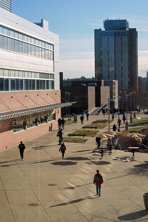 students walking on campus with Sprau Tower in background