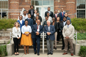New and former Greenleaf Trust scholars stand outside in front of Greenleaf Trust with President Edward Montgomery and William D. Johnston.