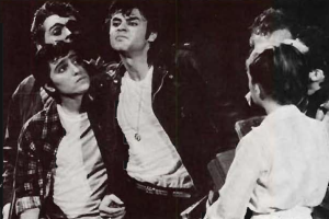 A black and white photograph of students dressed in leather jackets and t-shirts.