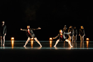 Dancers perform on a stage.