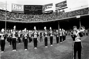 The Bronco Marching Band plays on an athletic field.