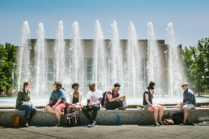 students sitting by miller fountain