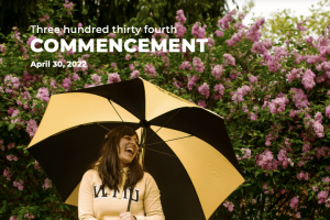 Program cover: A student with an umbrella posing by flowers on WMU's campus