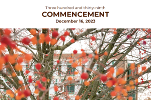 Program cover: A student walking through a snow-covered campus, framed by vibrant autumn foliage in the foreground