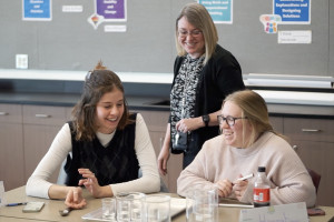 Students playing water xylophone