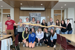 Class of students with snake