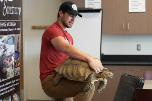 Man holding tortoise 