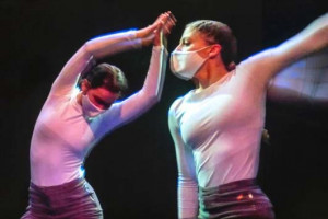 Two dancers perform.
