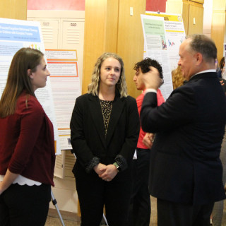 Students presenting at research day