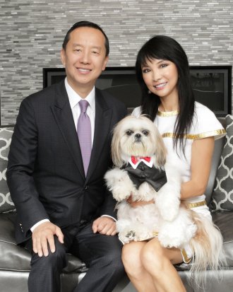 Pictured are Charles Zhang and Lynn Chen-Zhang with dog