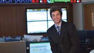 Photo of Jonah Shafer in the college's Greenleaf Trading Lab
