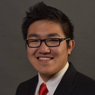 Professional photo of Jeff Huang in a suit and tie