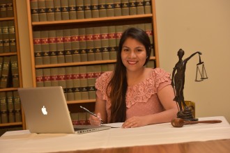 Pre-Law student sitting at a table in the Political Science library