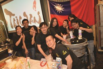 Taiwanese students smile with excitement in front of their booth at the 2017 International Festival. 