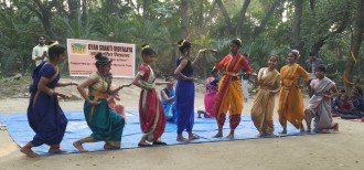 A group of Indian women in traditional clothes, dancing Indian.