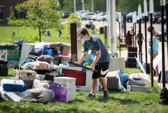 A student gathers belongings to take into a residence hall.