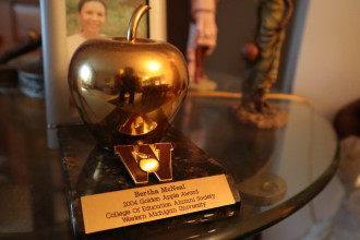 A trophy featuring a golden apple.