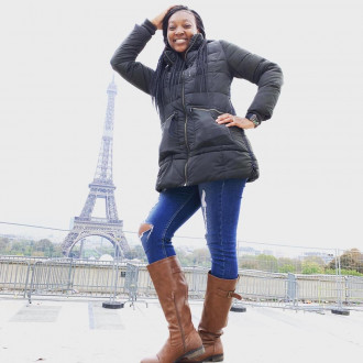 A photo of Jamilah Anthony at the Eiffel Tower.