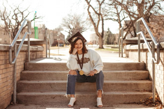 Alyssa Zamora sits on the steps