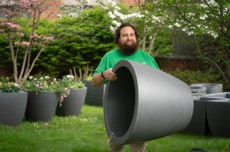 David Prellwitz carries a self-watering planter.