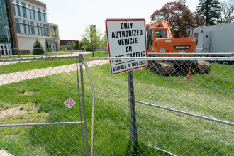 Construction fences in front of a sign that reads, "Only authorized vehicle traffic."