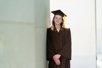 A portrait of Hawke Osterhout in her graduation attire.