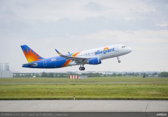 An Allegiant airplane takes off on the runway.