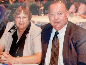 Margaret and Burt TenBrink sit at a table together.