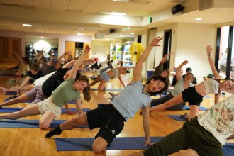 Students practice yoga.