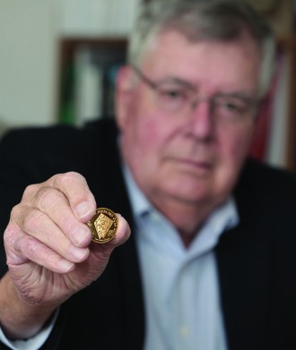 Steininger holding gold coin