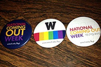 Photo of buttons depicting National Coming Out Day.
