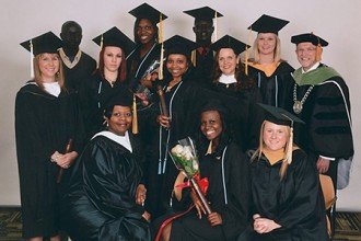 Photo of WMU graduates in caps and gowns.
