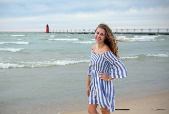 A student standing on the beach in South Haven, Michigan.