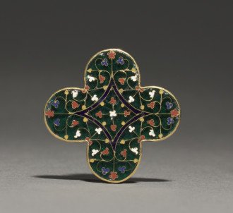 A fourteenth-century quatrilobed plaque featuring foliate designs made of green, white, red, and blue enamel and gold.