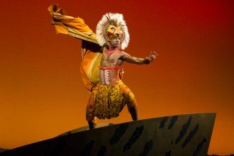 Photo of Dashaun Young in costume as Simba in the musical "The Lion King."