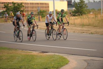 Photo of four bicyclists on the road at the Business, Technology and Research Park.