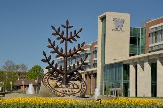 WMU's Sangren Hall and the Gathering Tree sculputre