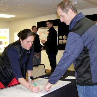 Kushner pointing to an area on WMU's campus map.
