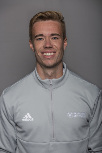 Philip Smith in light gray athletic jacket with darker gray background.
