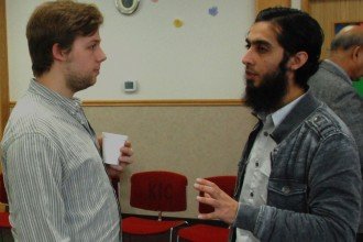 Imam talking with a student