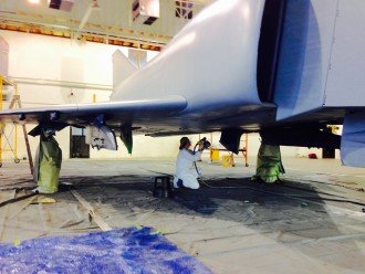 Claire Ranly painting plane