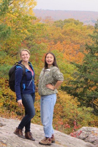 Two female students on overlook rock